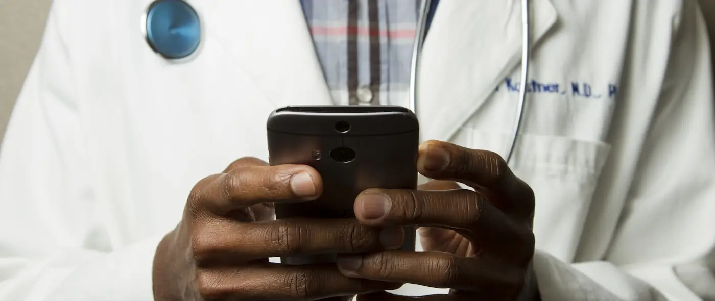 Healthcare professionals reviewing information on a tablet