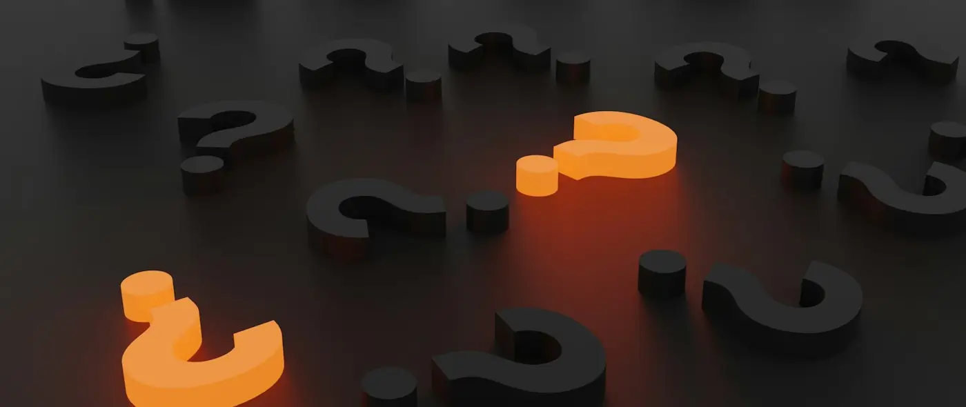 3D rendered question marks in orange and gray