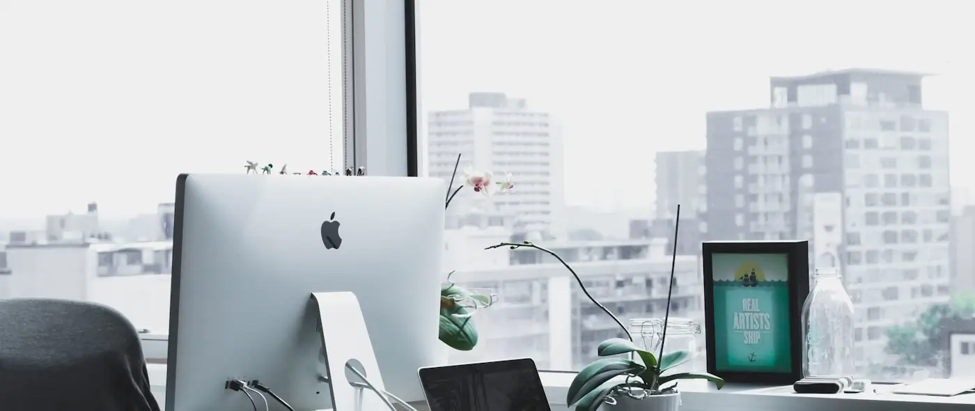 Modern co-working space with individual workstations and natural light