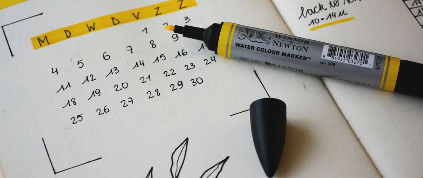 Black marker on an open notebook used for brainstorming