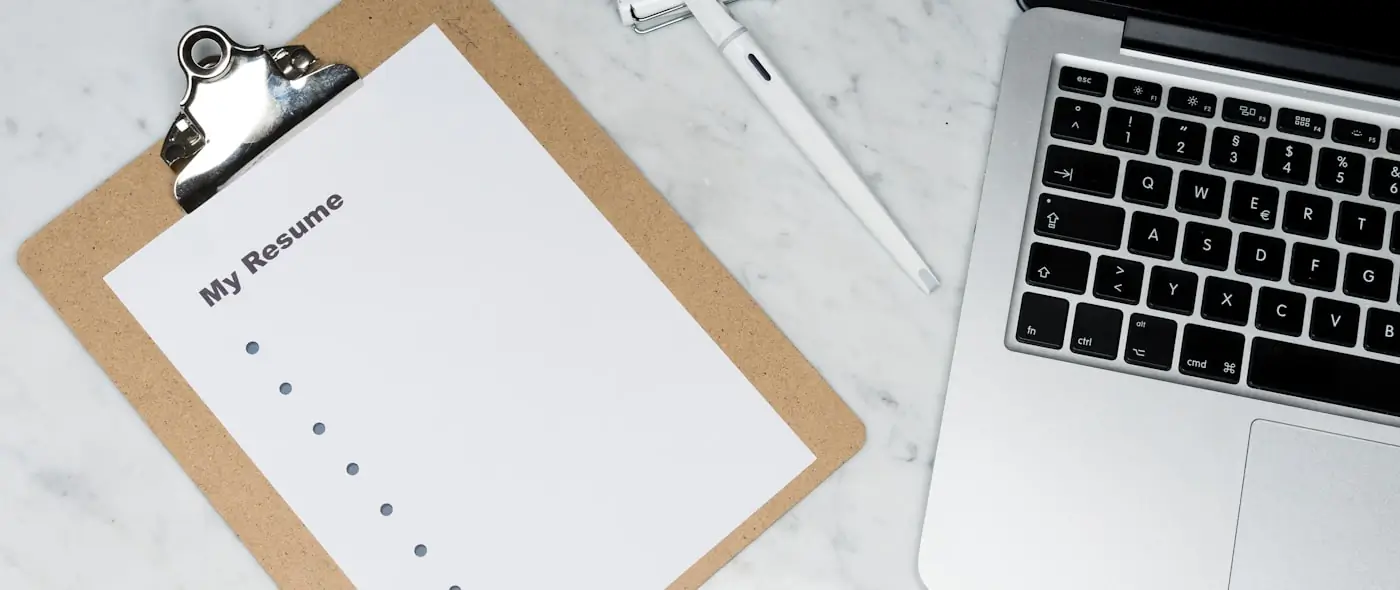 Organized notebook with tabs and sticky notes on a clean desk