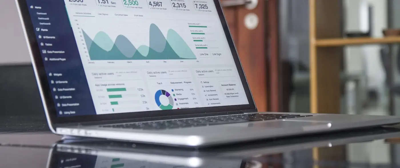 Analytics dashboard displayed on a laptop screen with charts and data