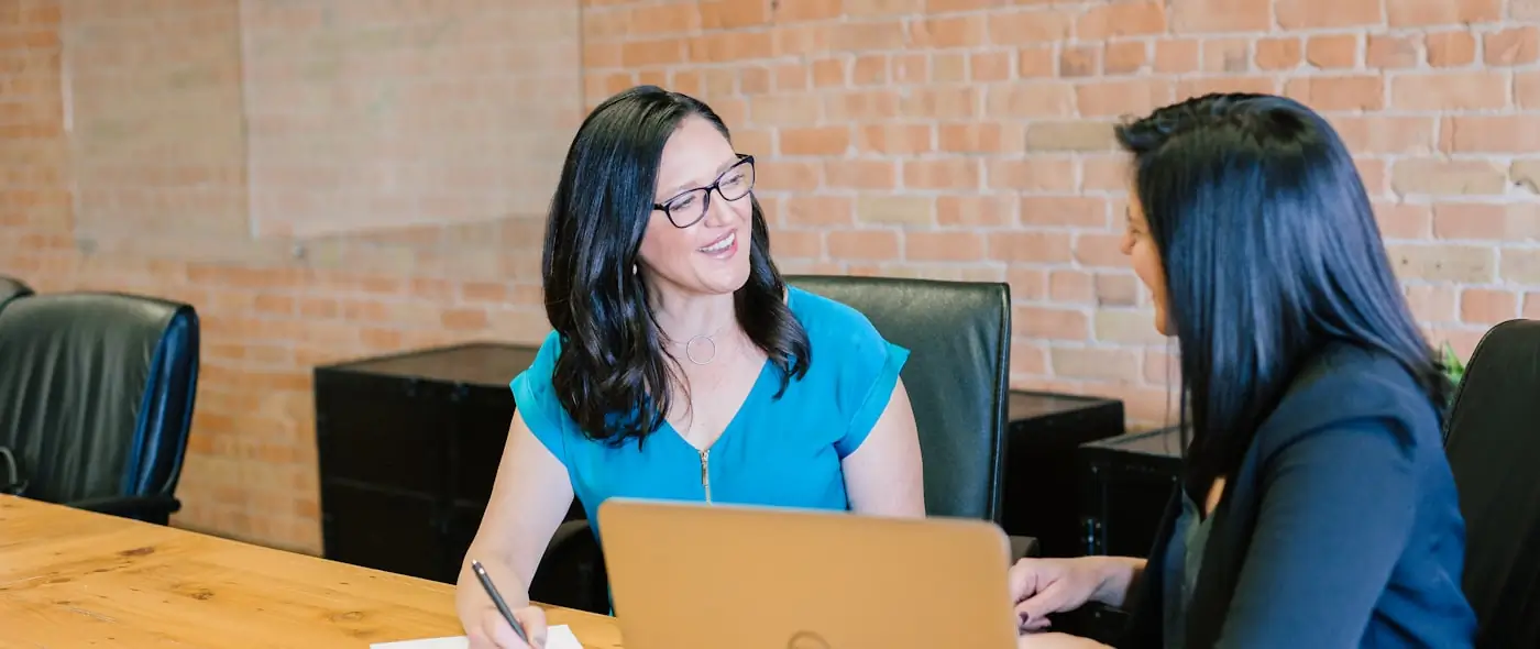 Professional woman presenting in a modern meeting room