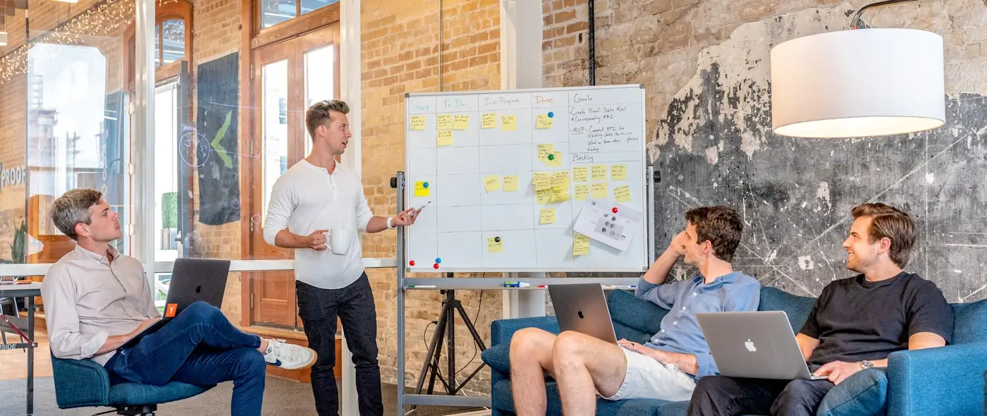 Two professionals discussing business at a modern conference table