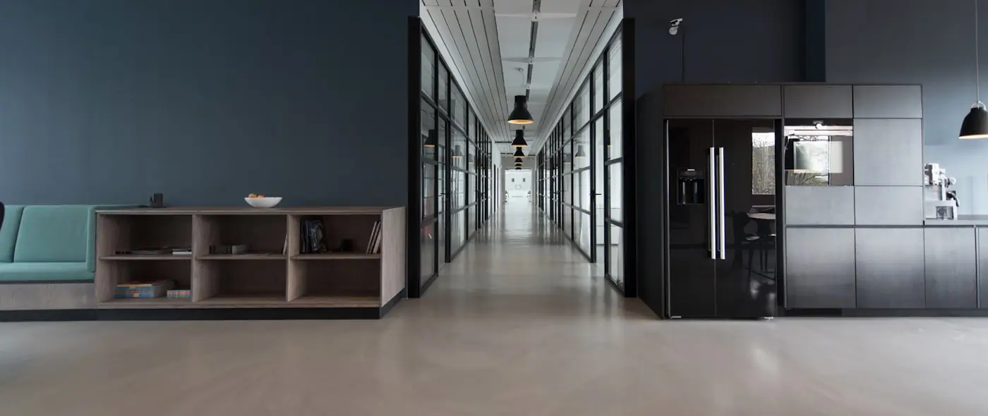 Modern open office with desks and large windows